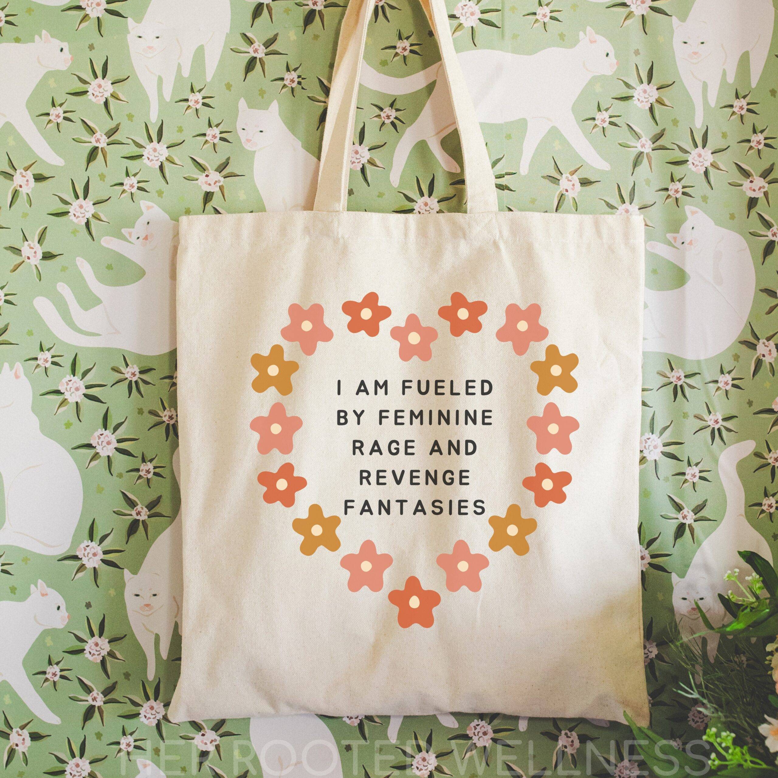 Tote bag with text I am fueled by feminine rage and revenge fantasies