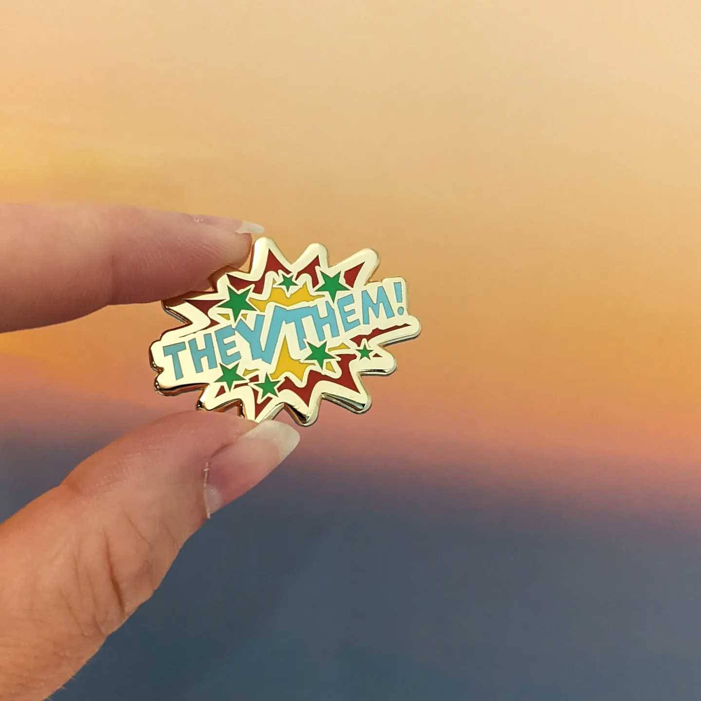 An enamel pin with text 