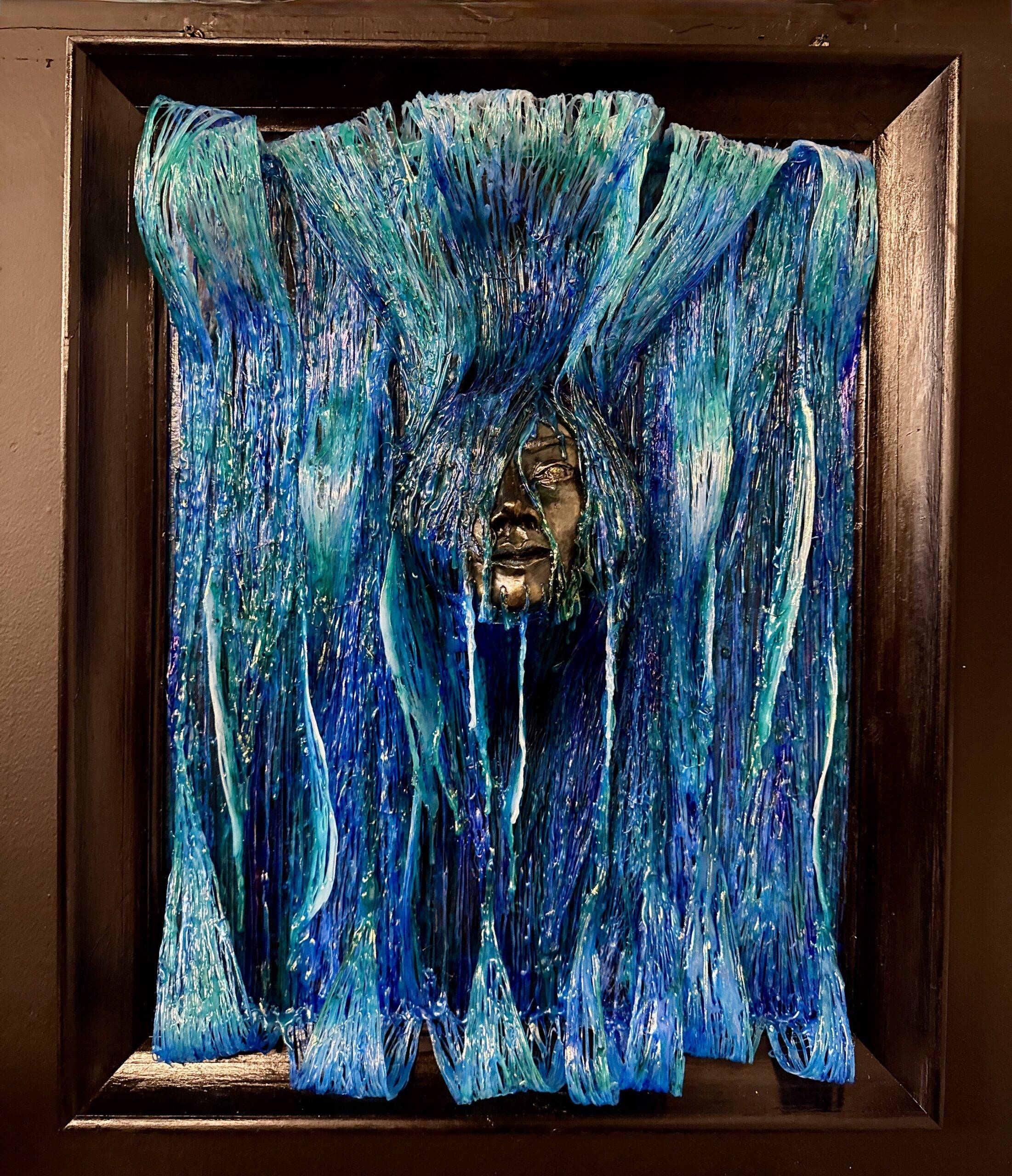 Image of a face being overwhelmed by a blue wave