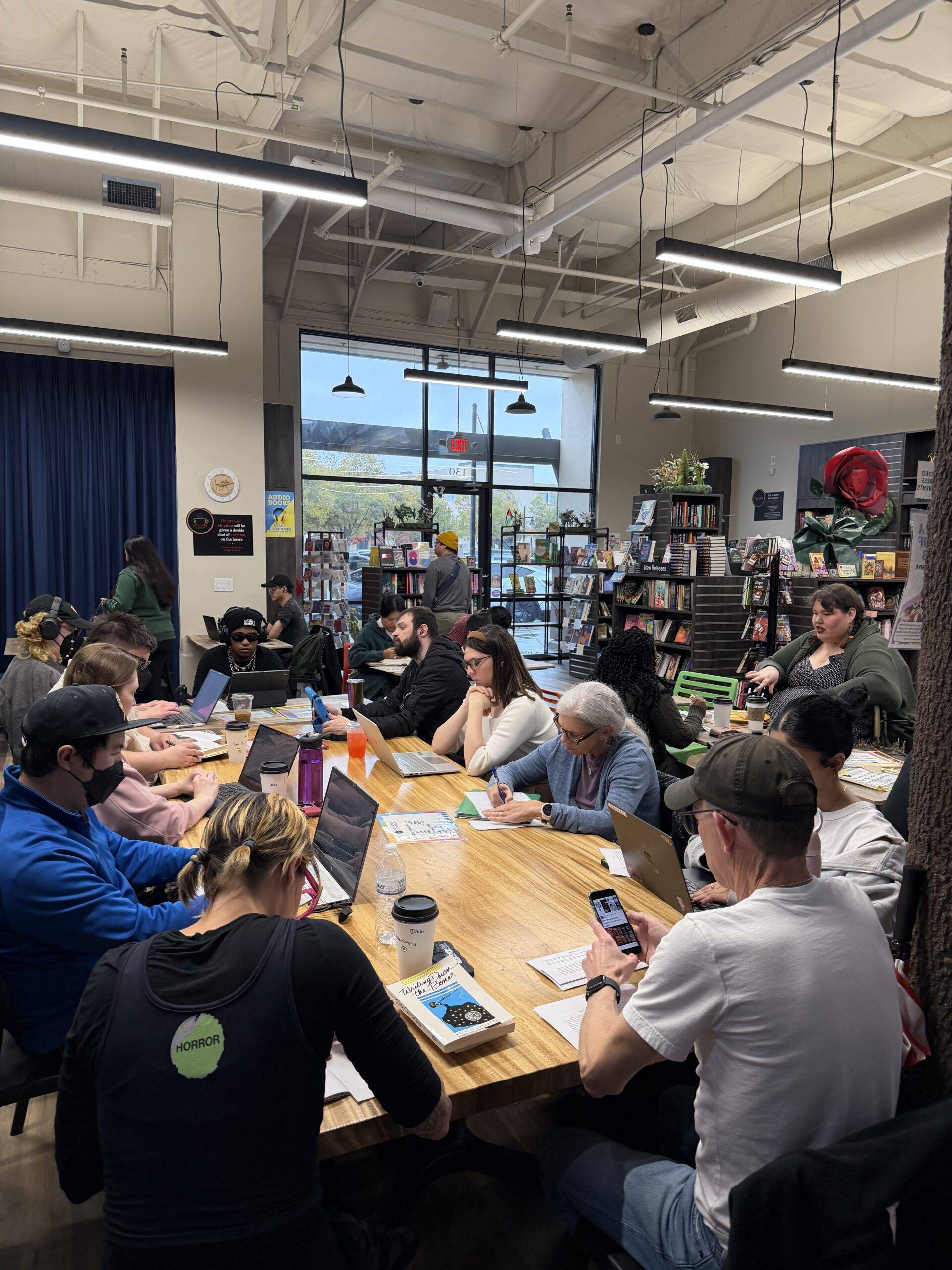 Writing group in front of bookshelves