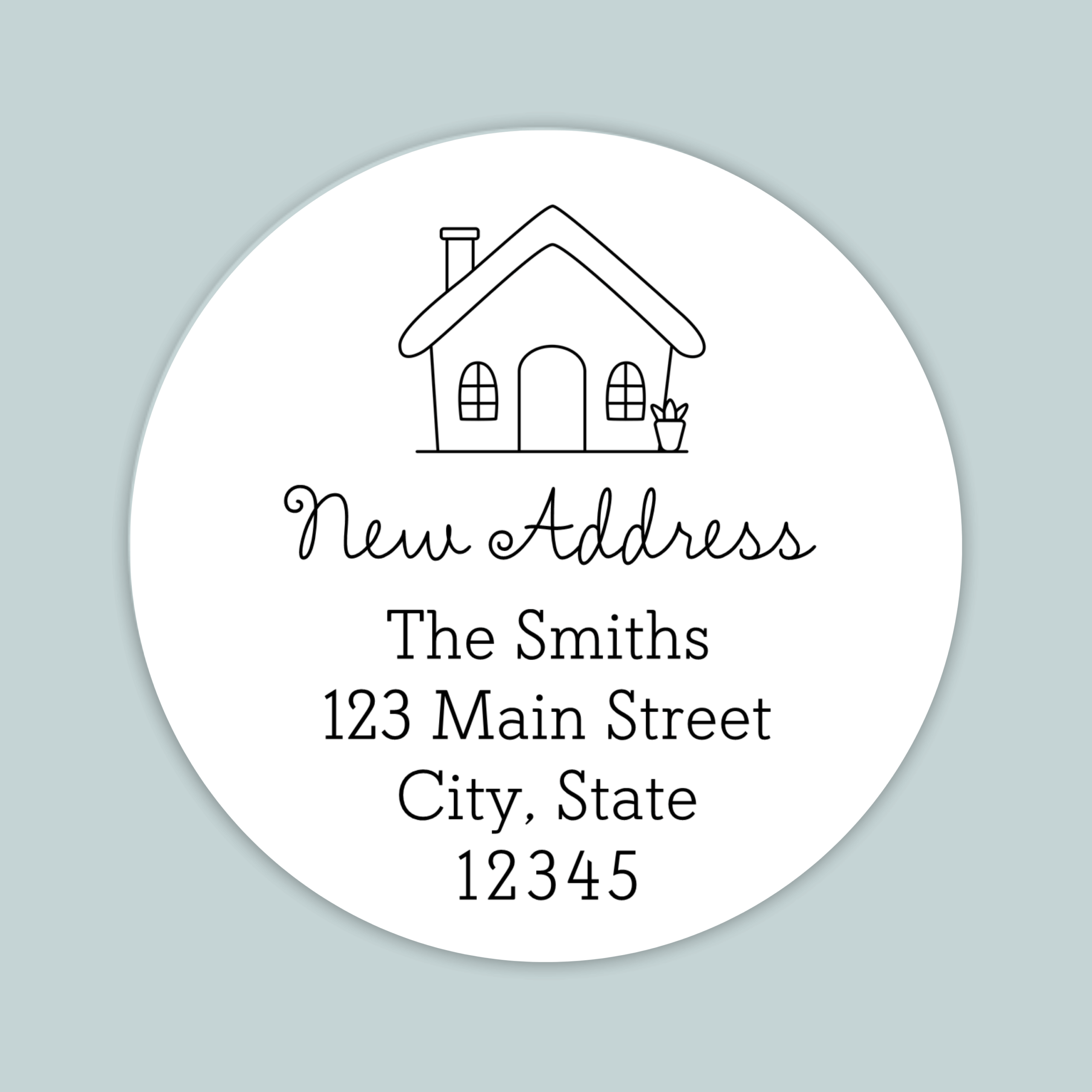 Round address label with hand drawn house and new address.