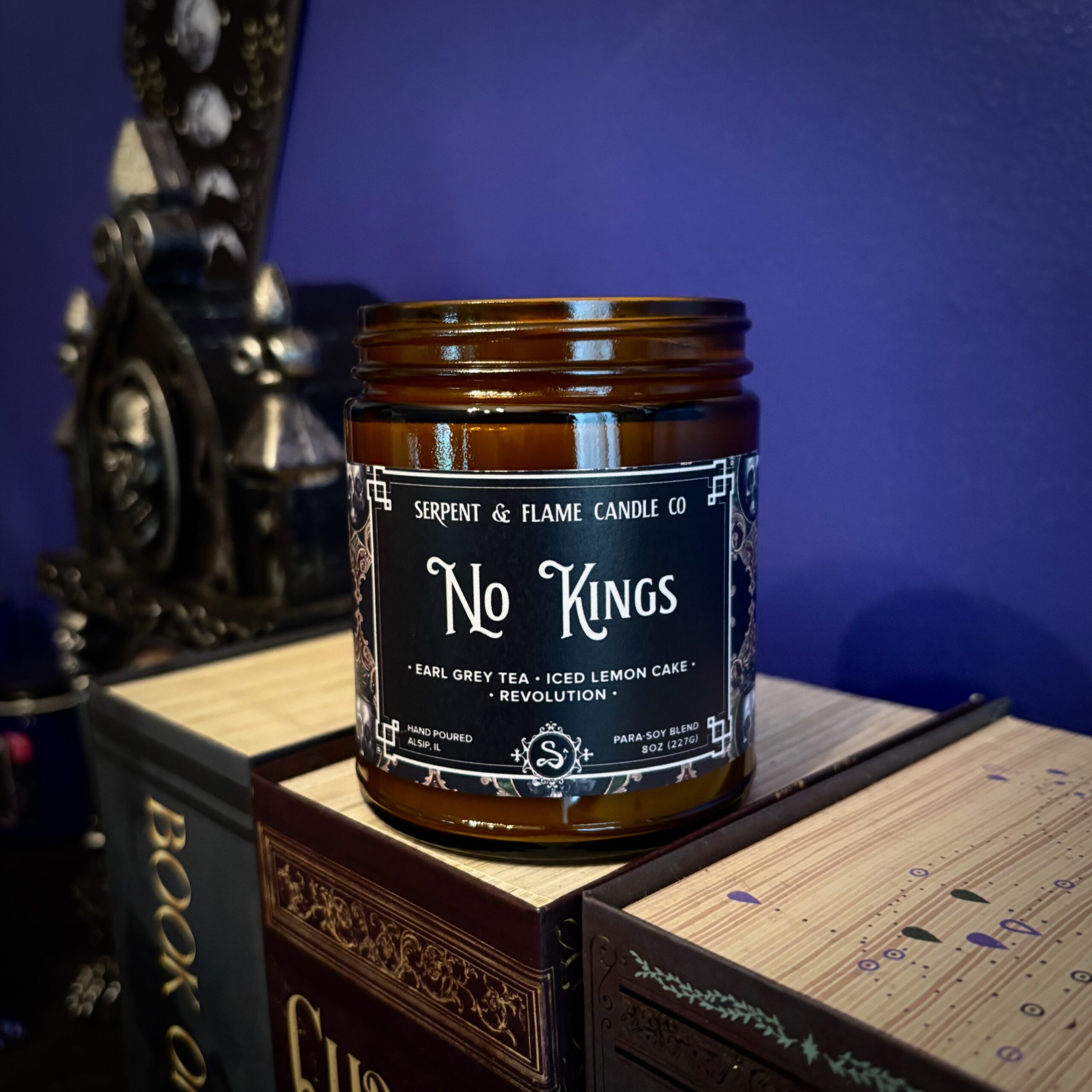 Amber colored candle jar with the words 