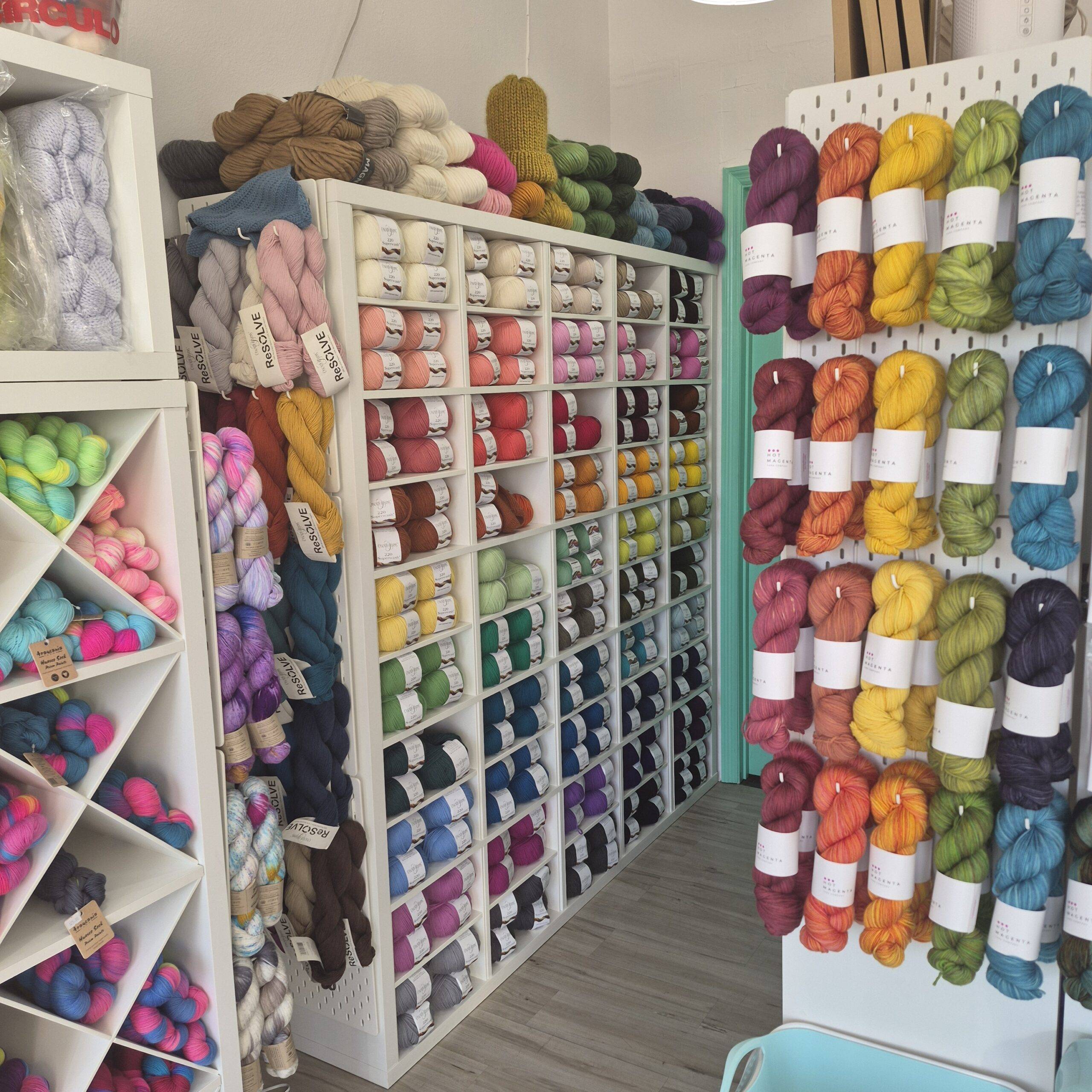 this photo shows loads of colorful yarn on display at the yarnmönger.