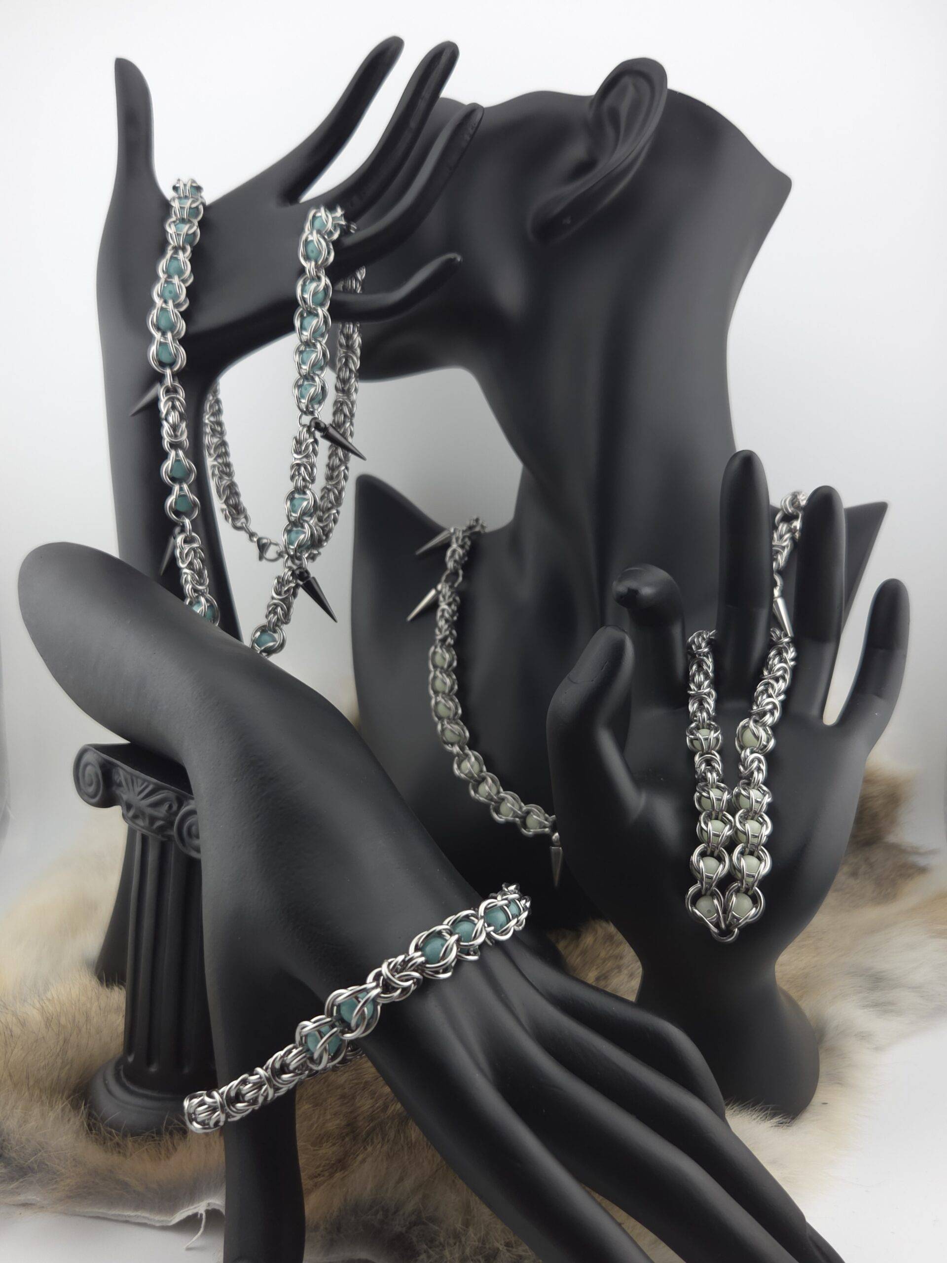 Stainless steel glow jewelry, accented with yellow glow beads and stainless steel spikes.