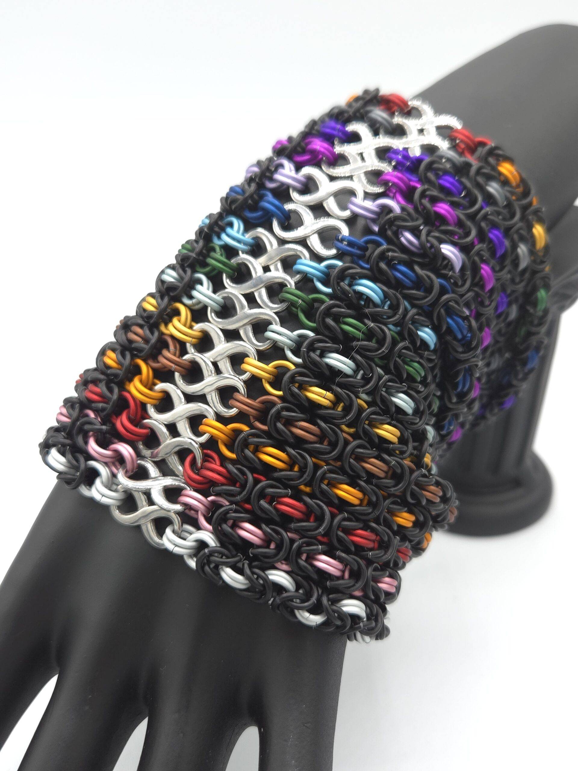 A full set of infinity bracelets, representing the rainbow of colors, and Foxweave Studios' commitment to LGBTQIA+ support.