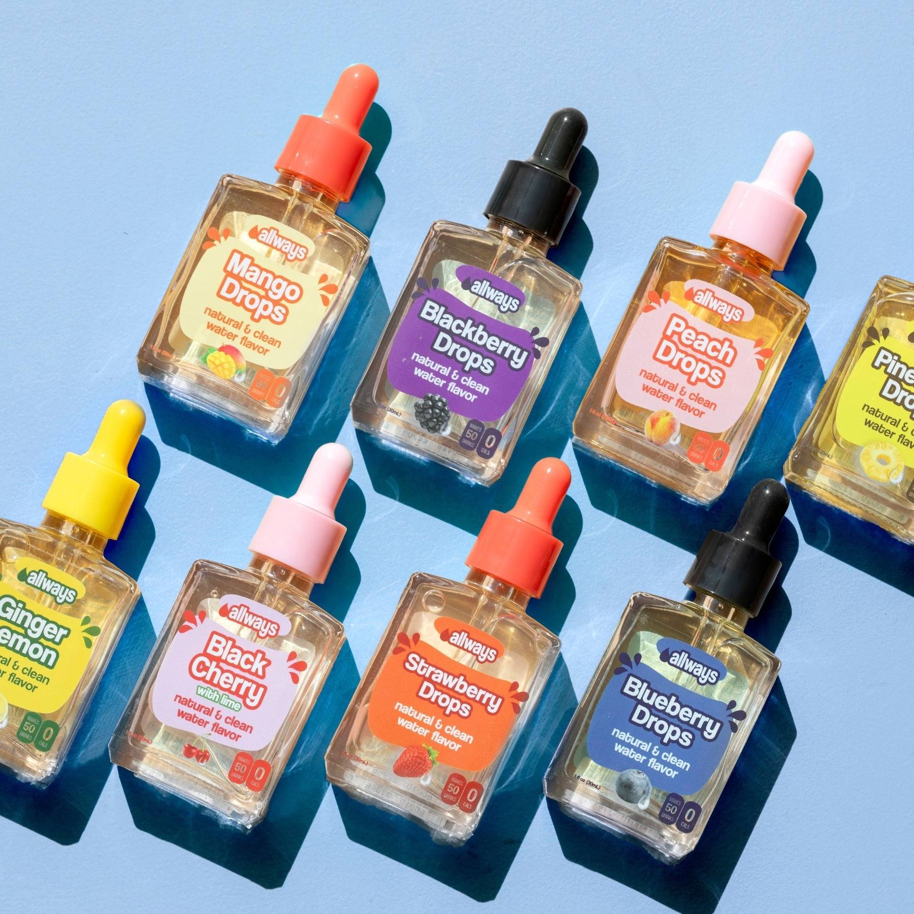 Blue background with multiple flavors of Allways glass bottles laying down.