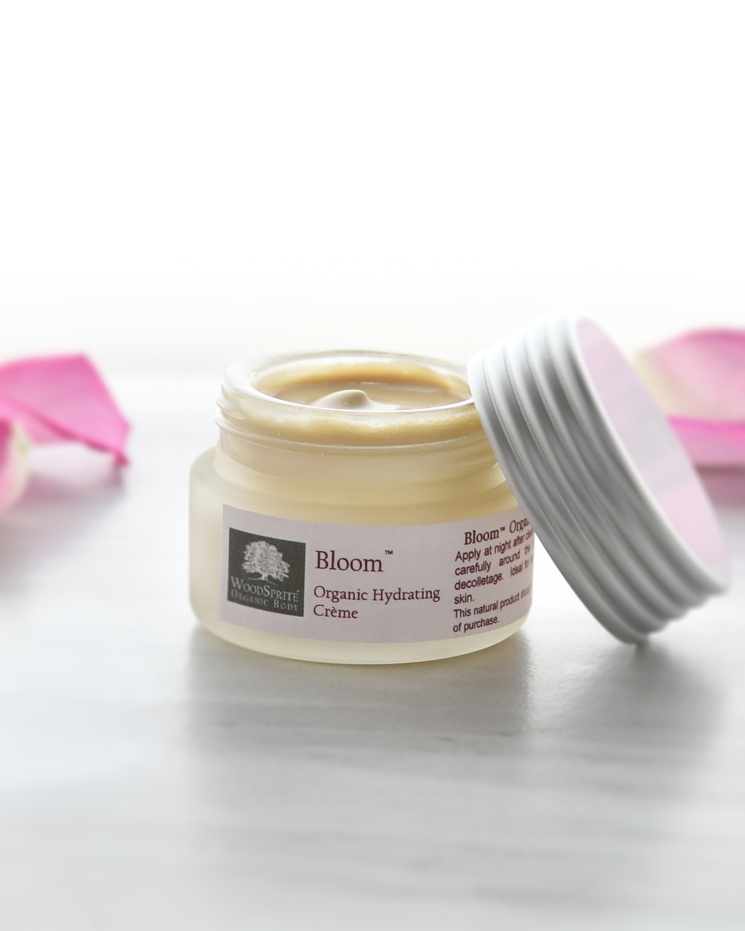Bloom organic hydrating creme in open jar.
