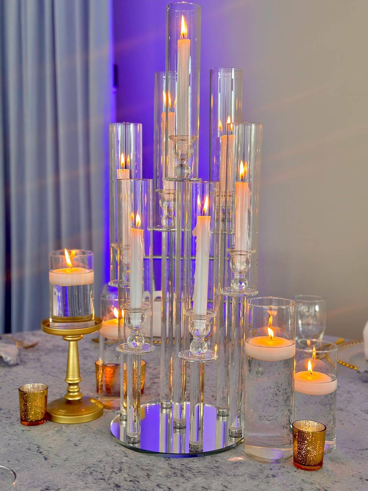 Crystal candle centerpiece with dusty blue tablecloth