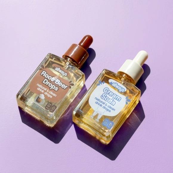 purple background with Allways Drops Root Beer and Cream Soda Flavors laying next to each other