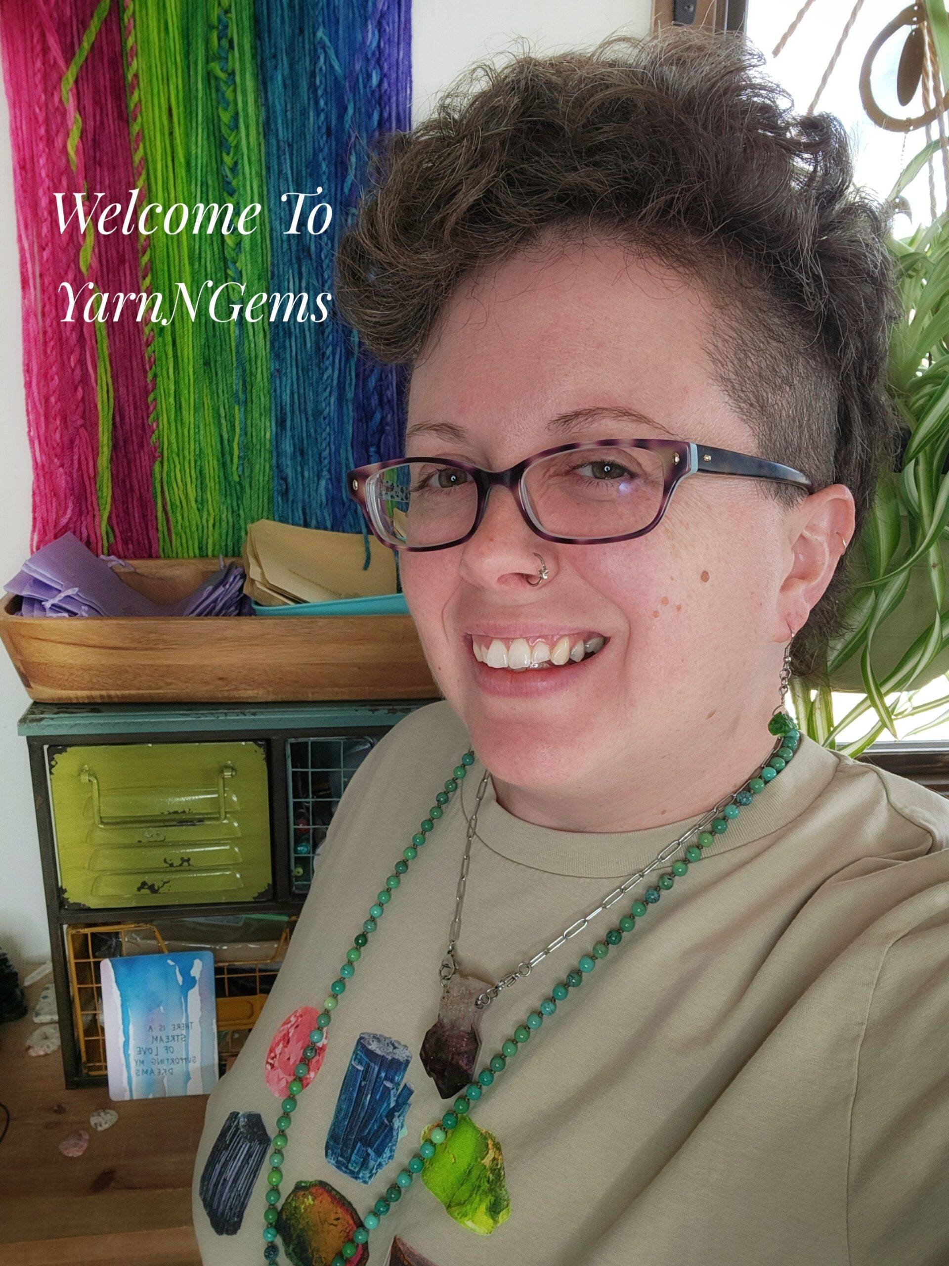 Crystal, the Owner and Creator behind YarnNGems, modeling some of her own handmade natural crystal jewelry.