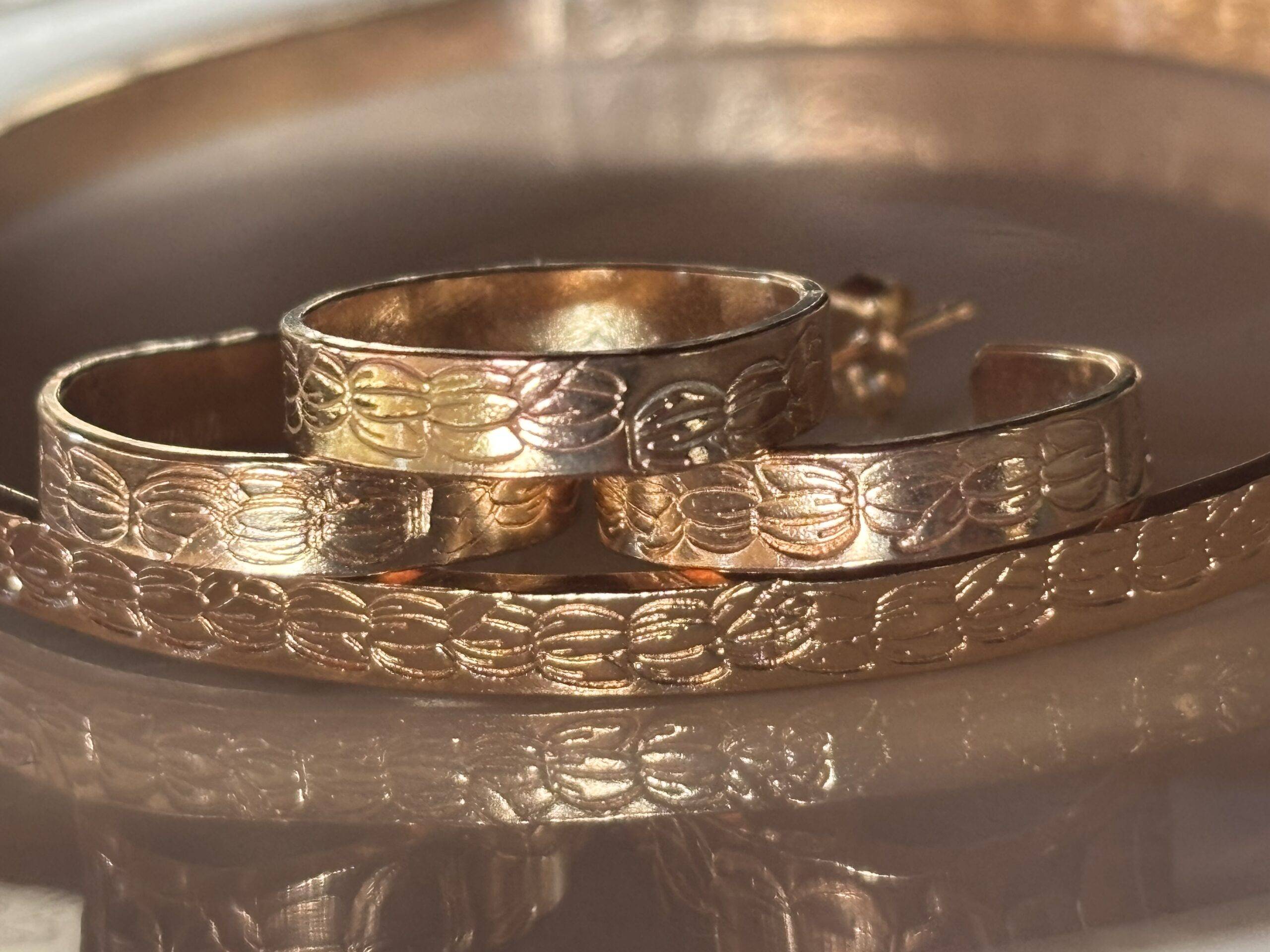 Handstamped Gold-Filled Pikake bangle, hoop earrings, and ring
