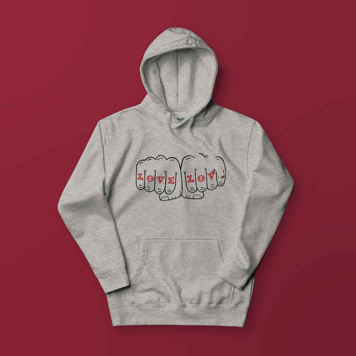 A gray hoodie with a design of two fists that reads LOVE LOVE