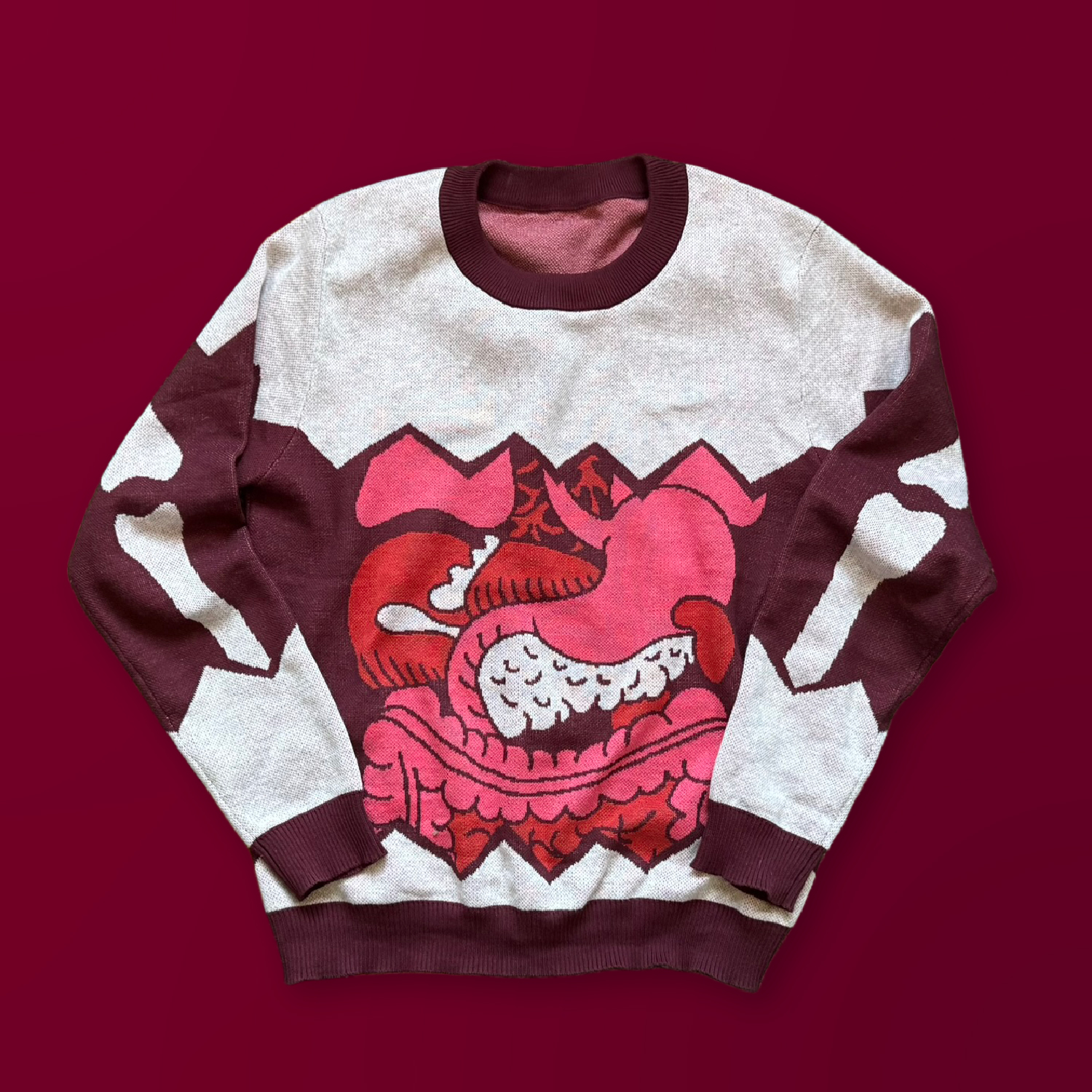 A white sweater with the design of 