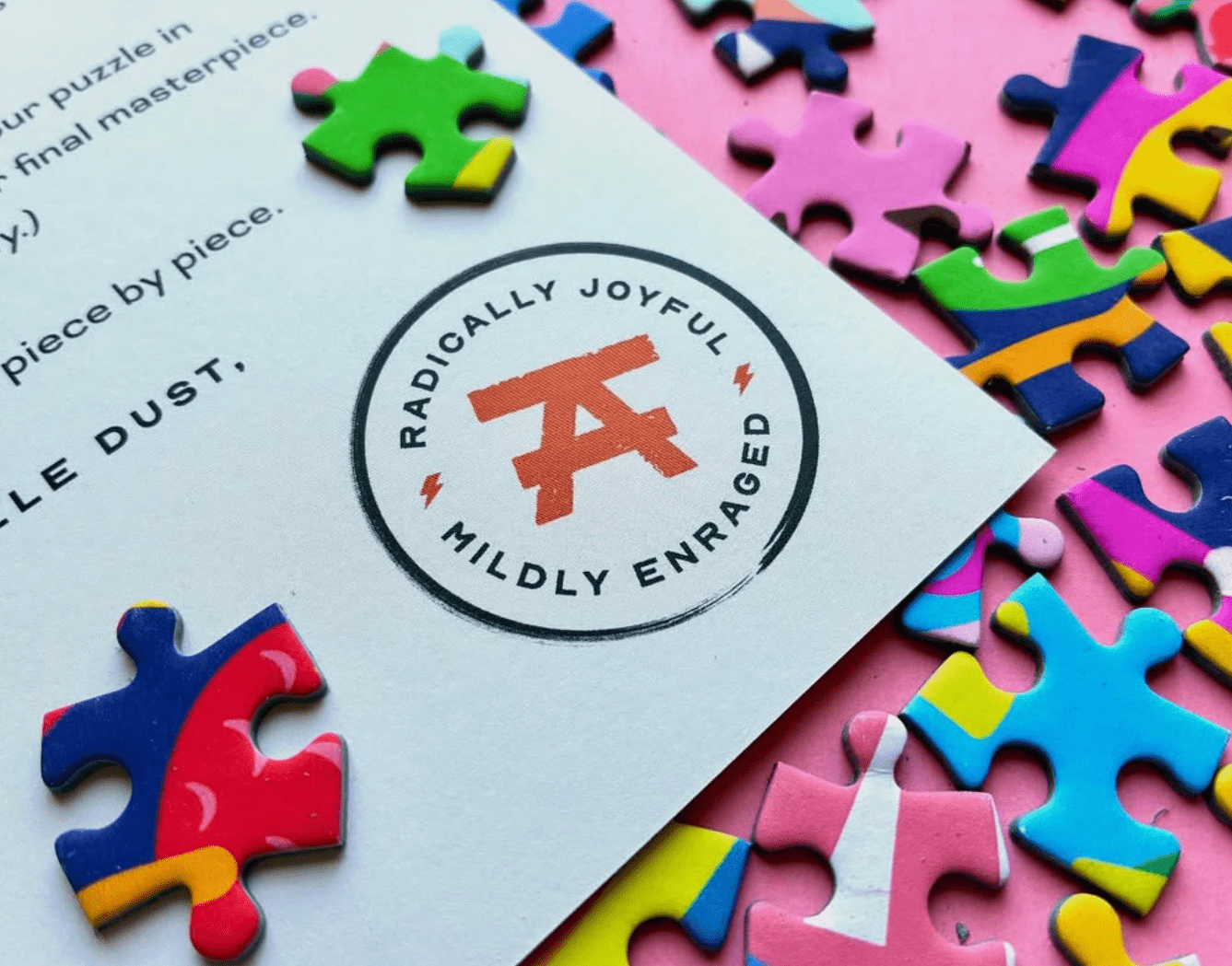 Artfelt Puzzles stamp that says Radically Joyful. Mildly Enraged.