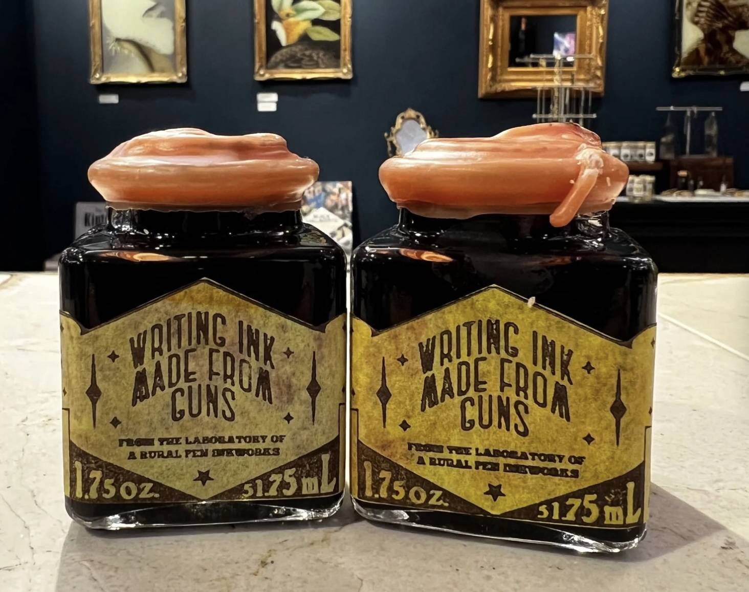 two bottles of ink that say 