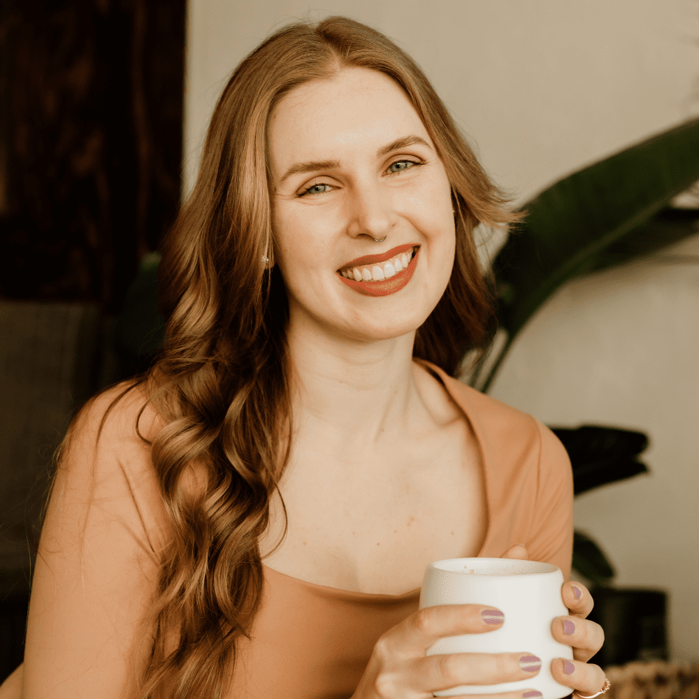Smiling blonde woman with coffee mug