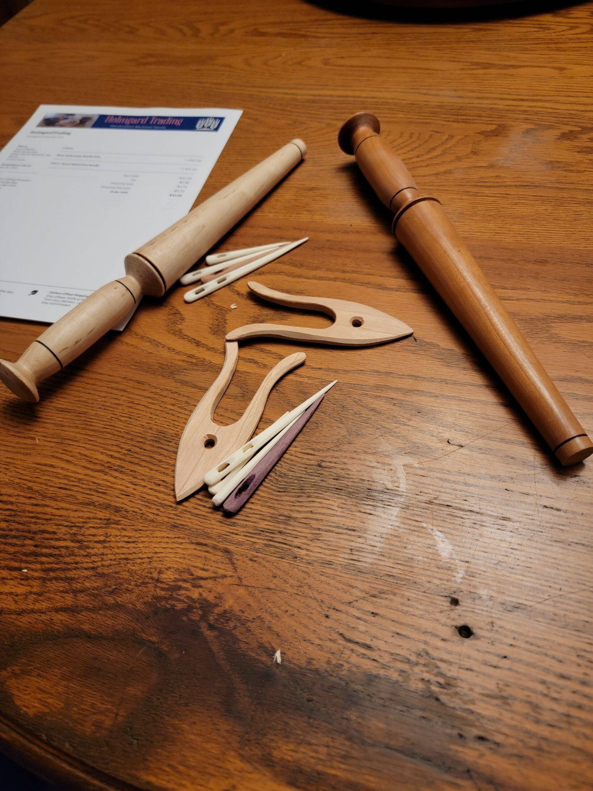 Hand-turned nostepinnes, and wood and bone nalbinding needles