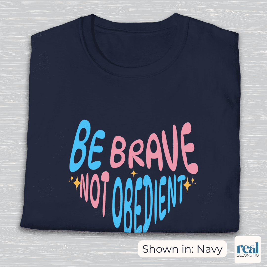 Heart-shaped, trans pride colored, pink and blue text that reads: Be brave, not obedient