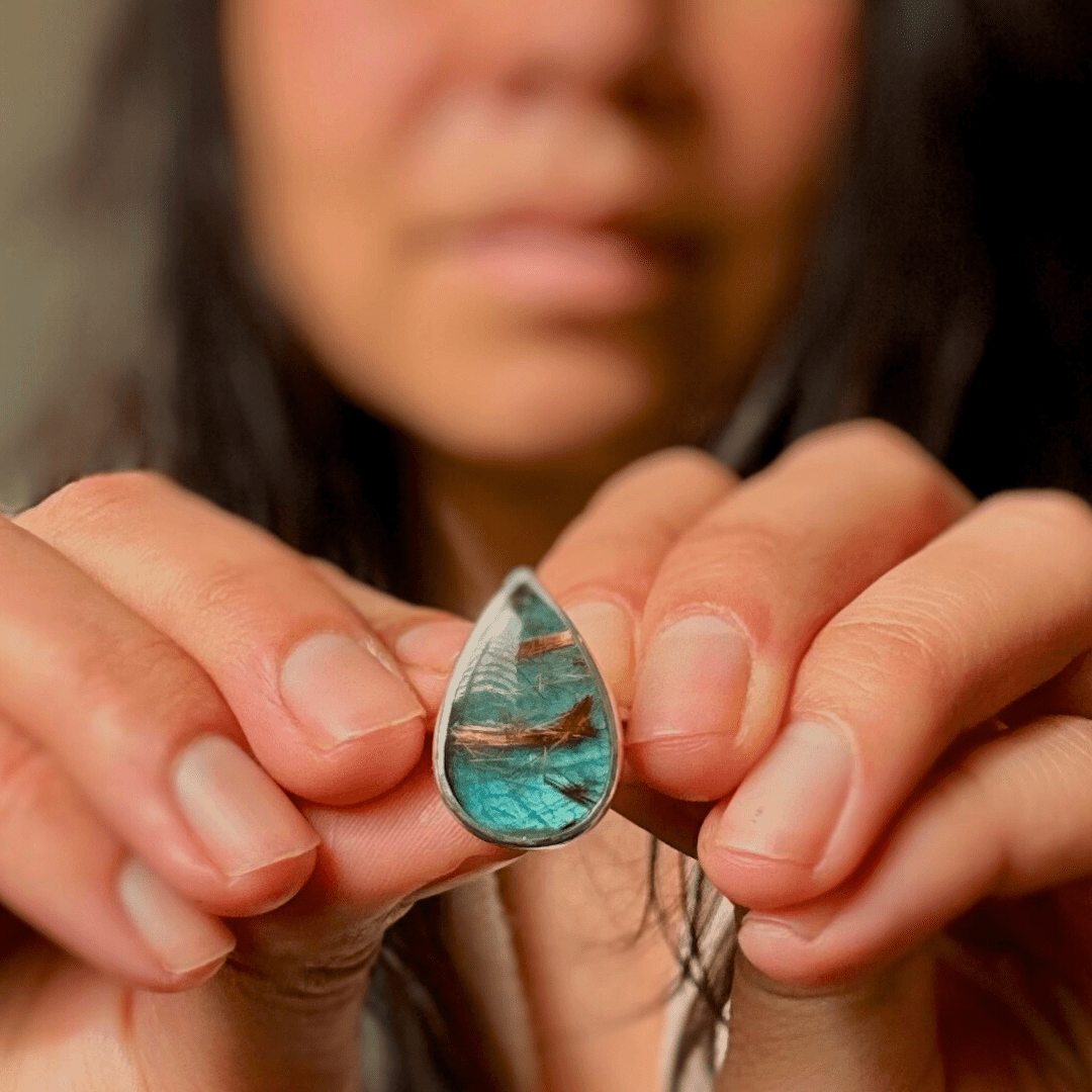 Image of sterling silver ring with rutilated quartz & labradorite stone. The ring band is made from triangle wire.